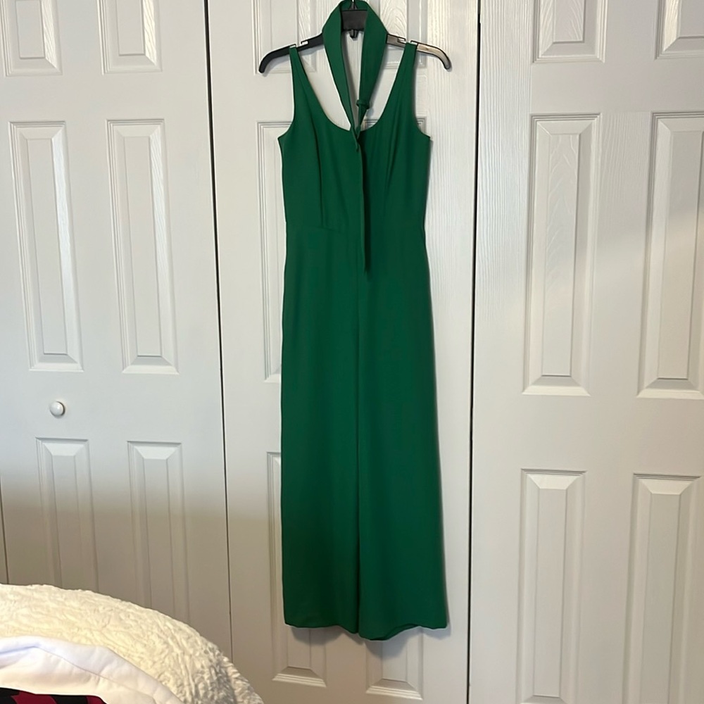 Wide leg belted Kelly green jumpsuit with pockets.